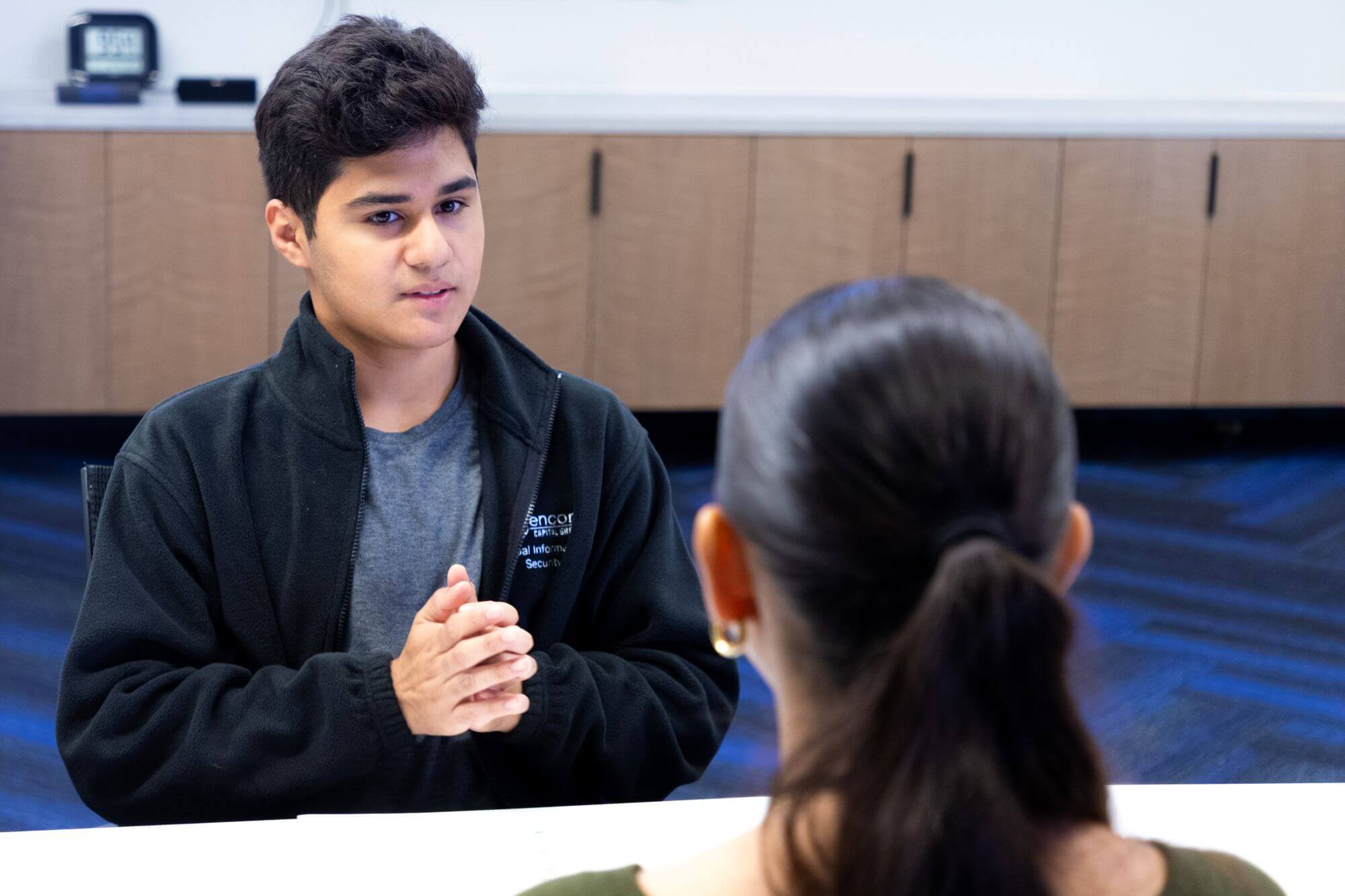 Student talking with site host employee