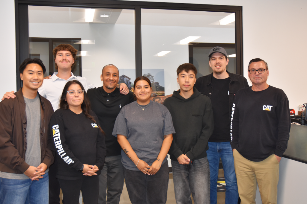 Group of Hawthorne employees with interns smiling